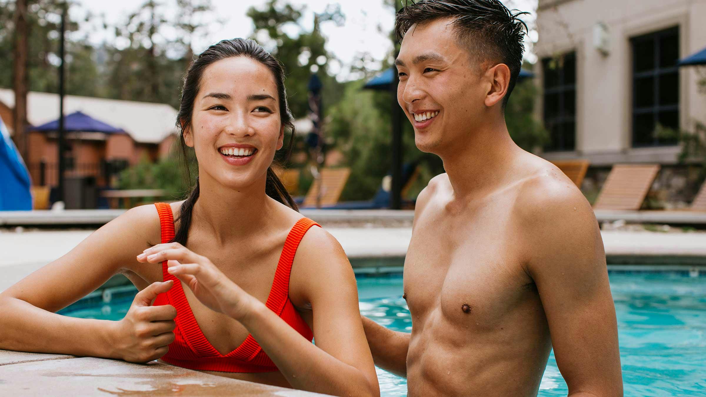 Couple relaxing in a pool at a Mammoth Hotel.