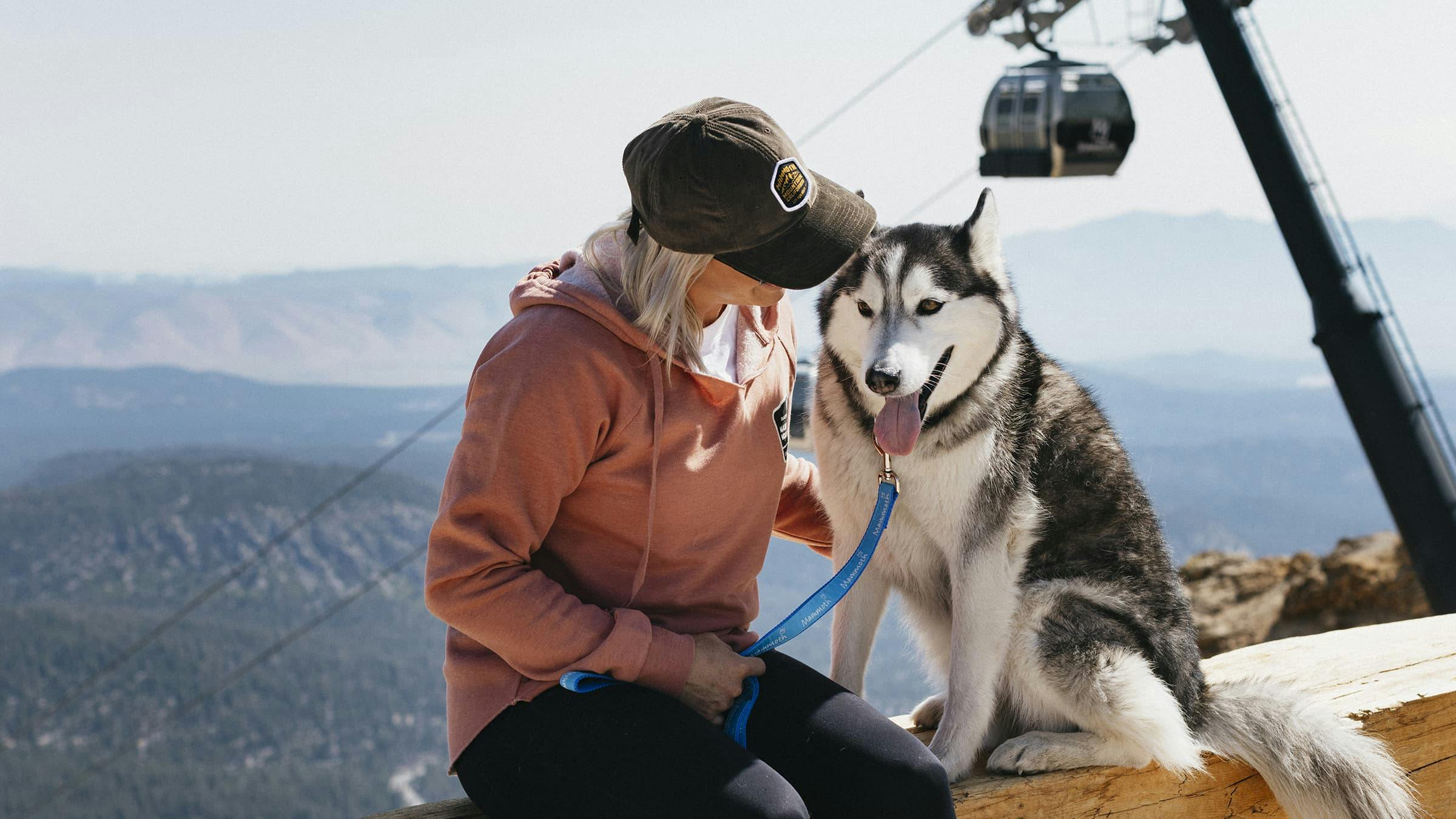 Woman and her dog at the top of Mammoth Mountain.