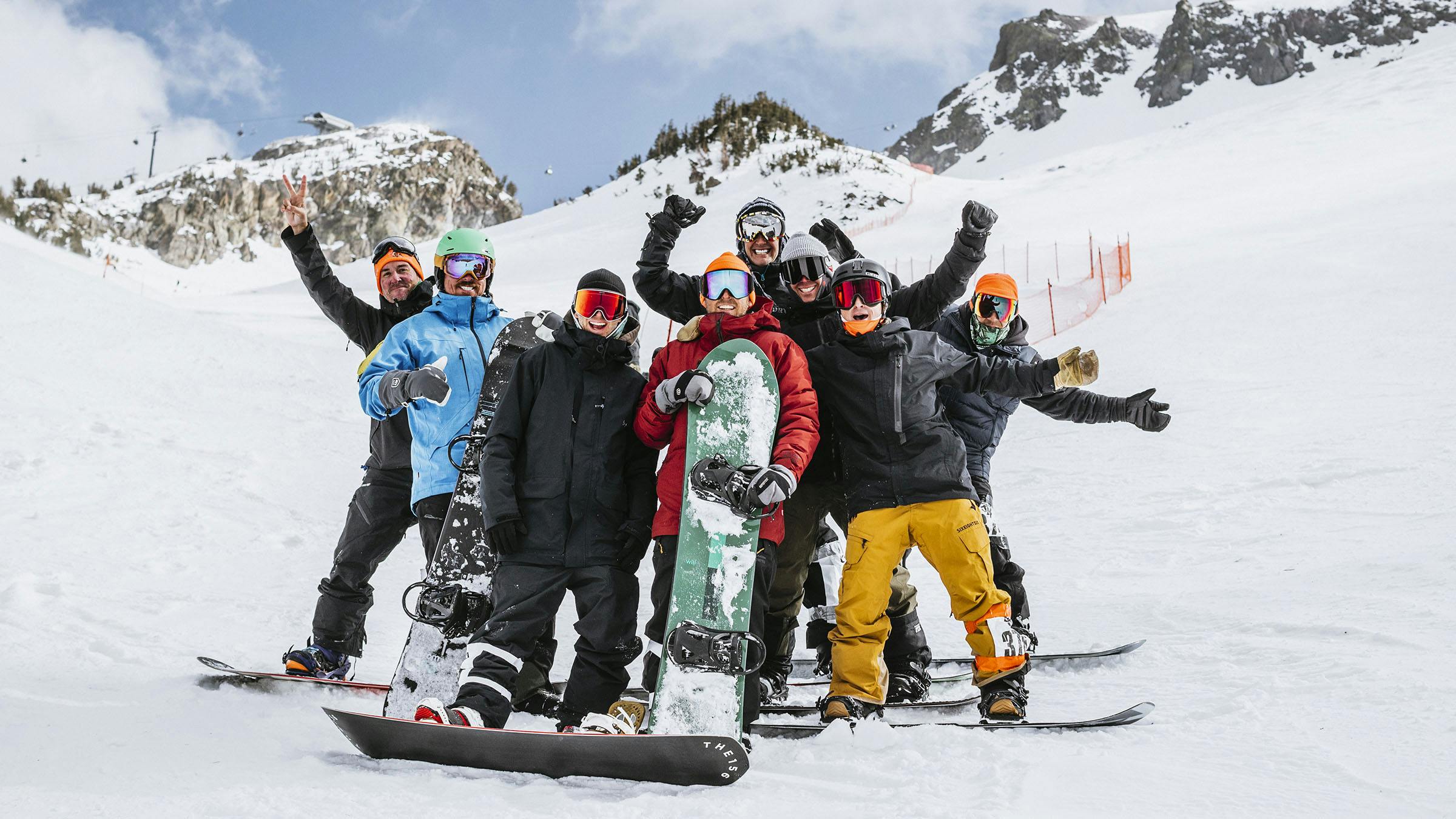 Group of snowboarders posing for photo at JLA Banked Slalom fun race