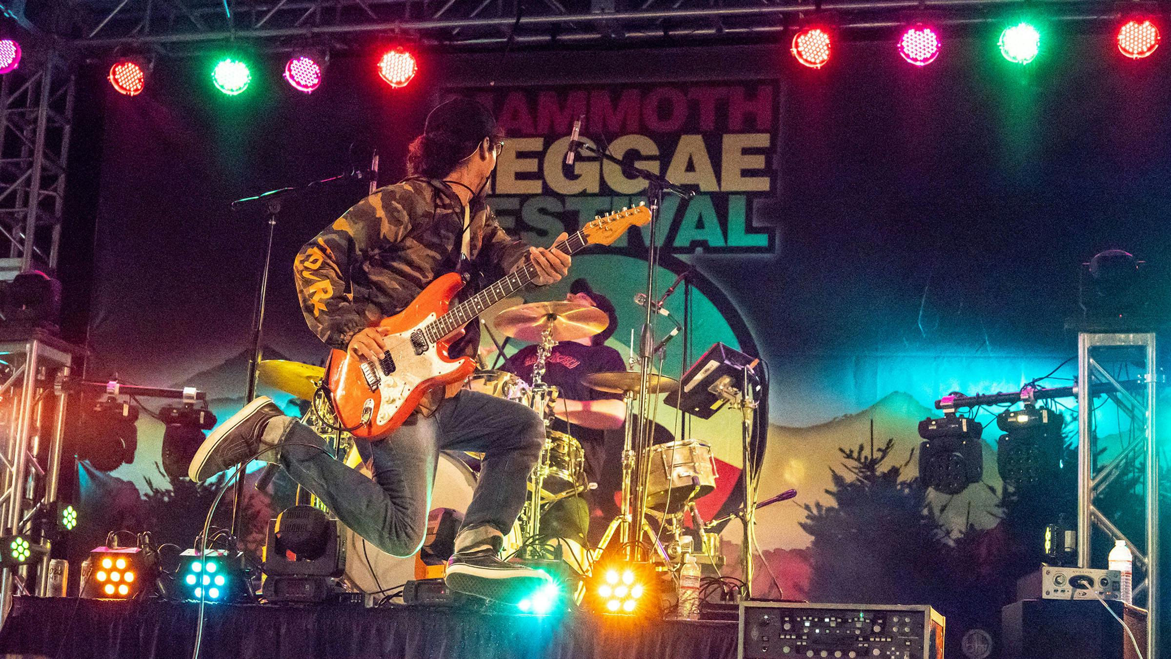 Musician on stage at Mammoth Reggae Festival in Mammoth Lakes, CA