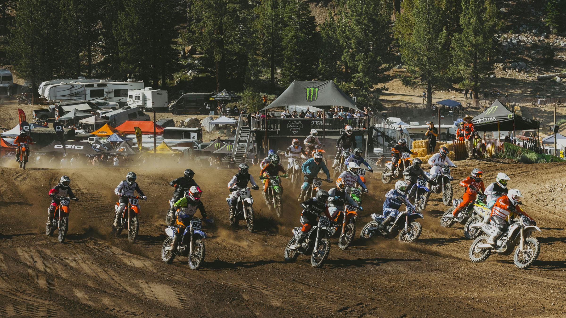 Mammoth Motocross racers on track with tents in background