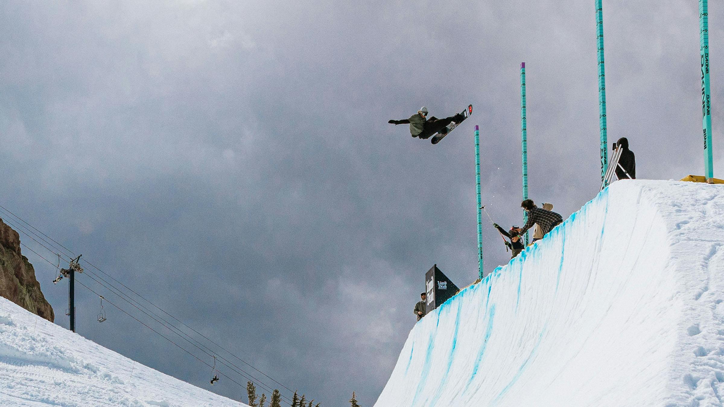  Snowboarder in the air on quarterpipe