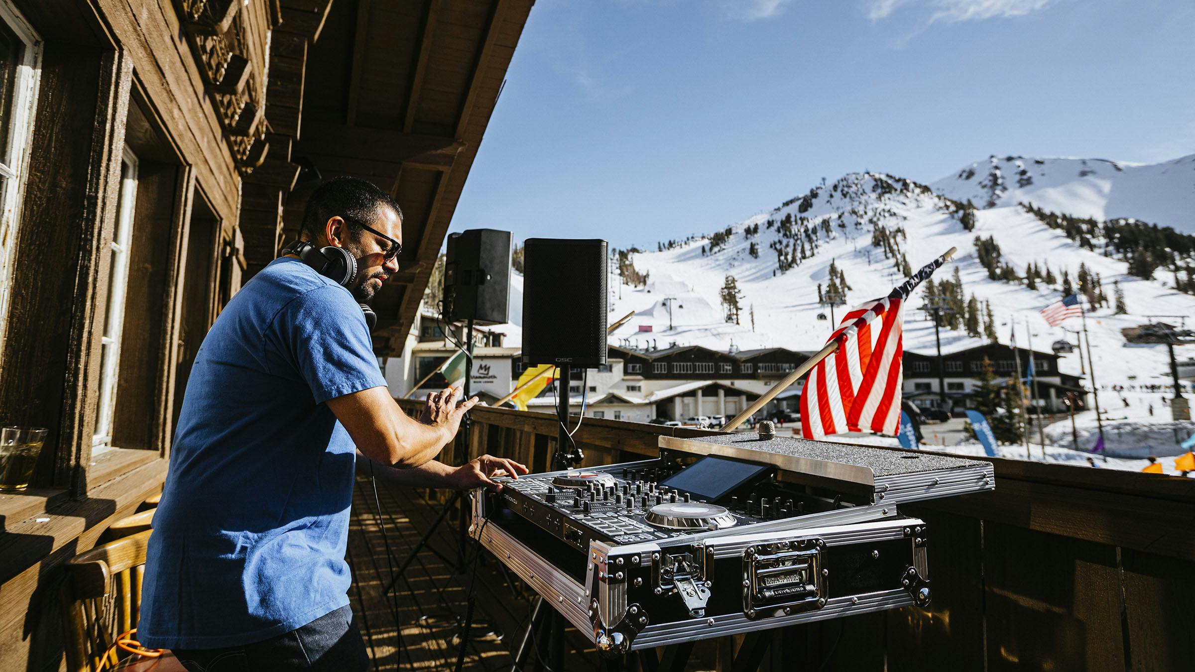 DJ at the Yodler Restaurant & Bar with Mammoth Mountain in the background