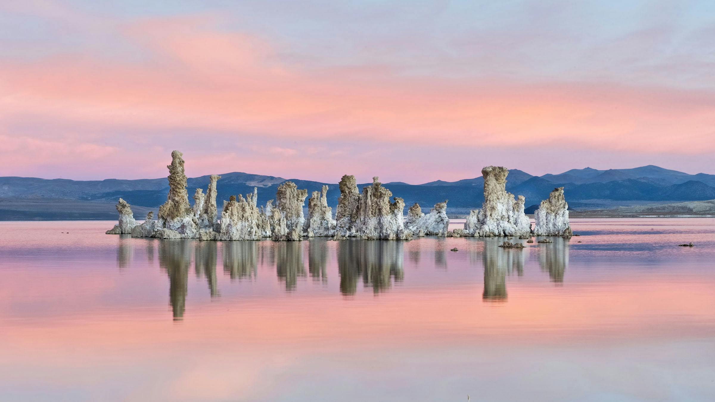 Mono Lake reflection and tufa formations with pink clouds