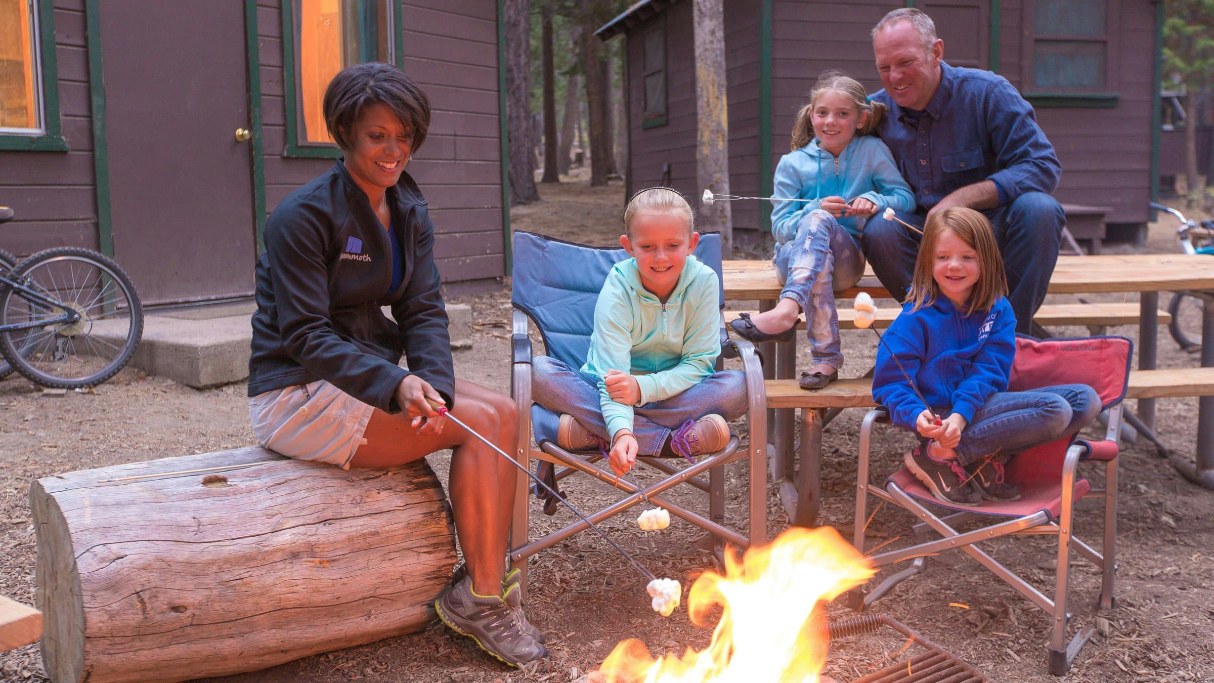 Family roasting smores at Camp High Sierra