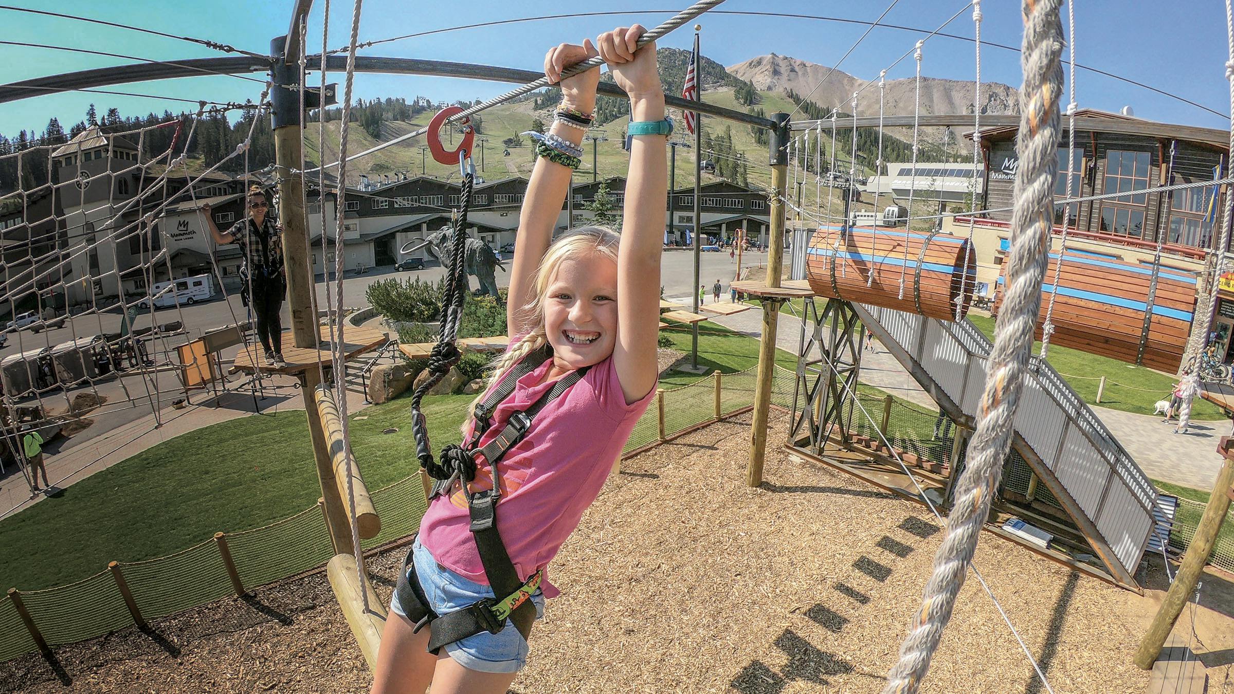 Girl climbing ropes course at the Adventure Center at Mammoth Mountain
