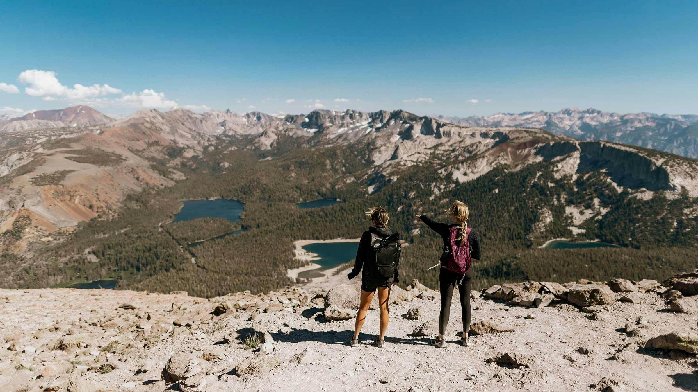 Two women overlooking the Lakes Basin