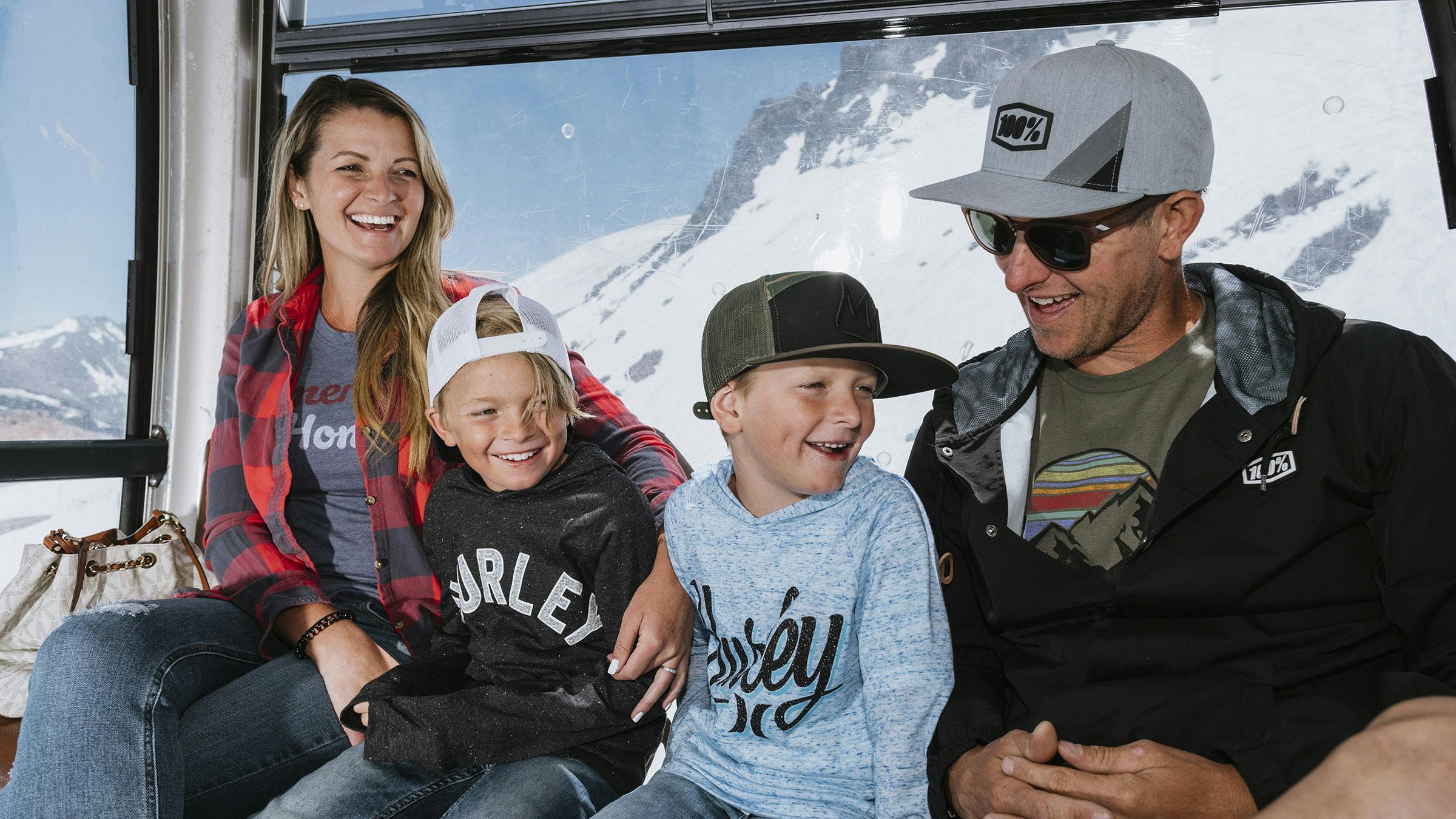 Family of four riding the Panorama Gondola at Mammoth Mountain