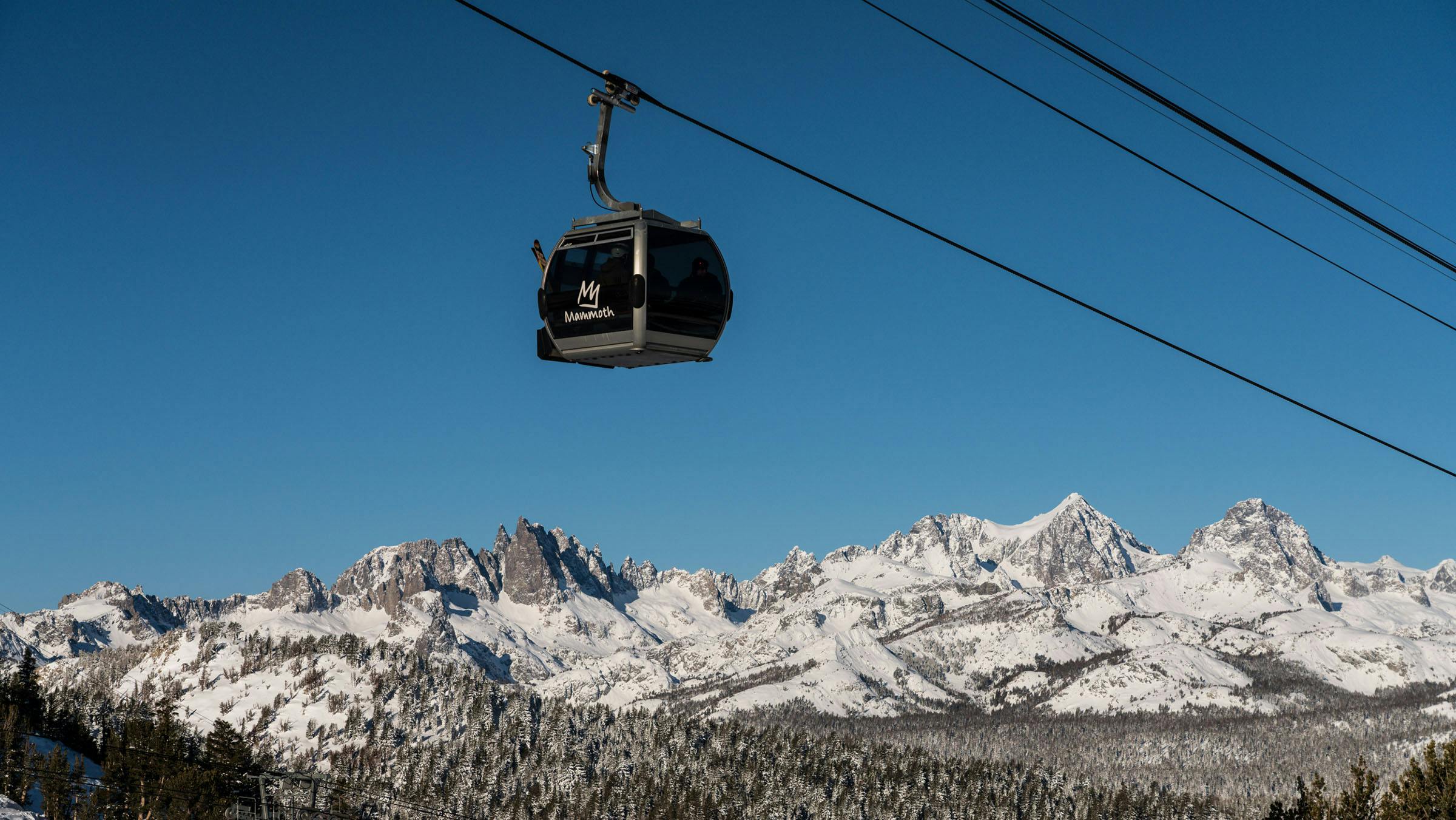 Mammoth Mountain Panorama Gondola car with scenic view of the Minarets covered in snow