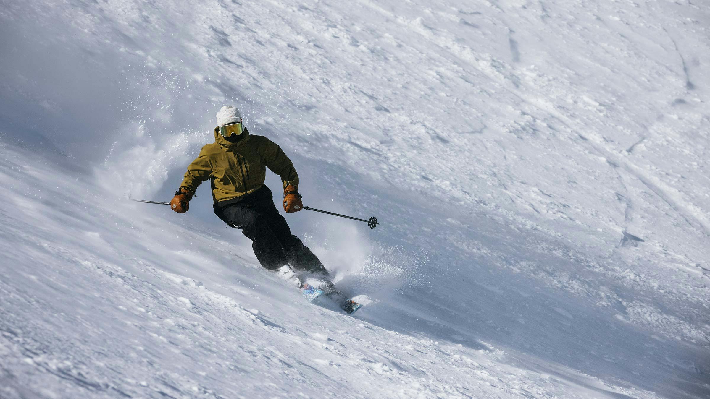 Skier on steep slope
