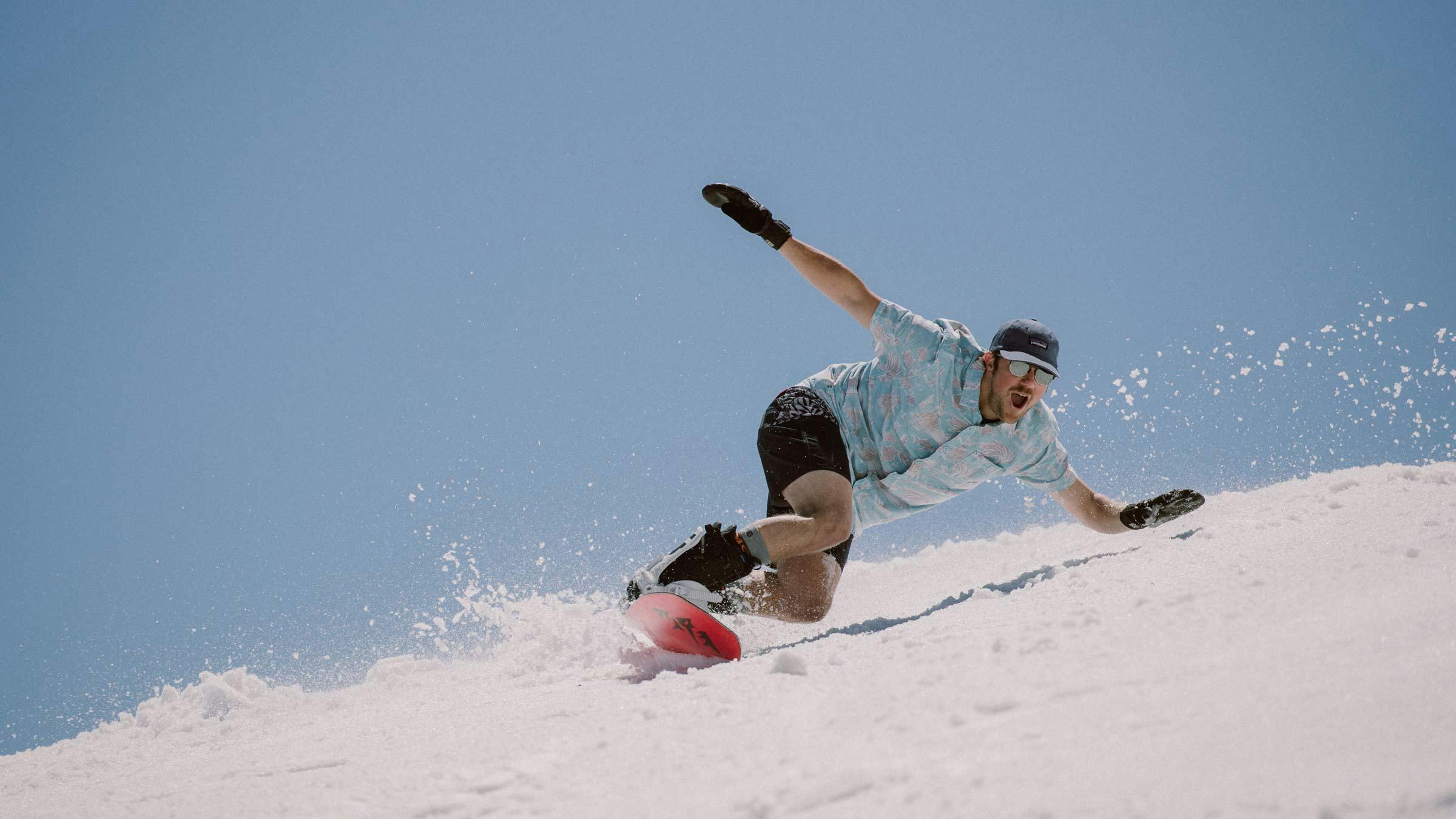 Snowboarder at Mammoth Mountain shredding in summer.