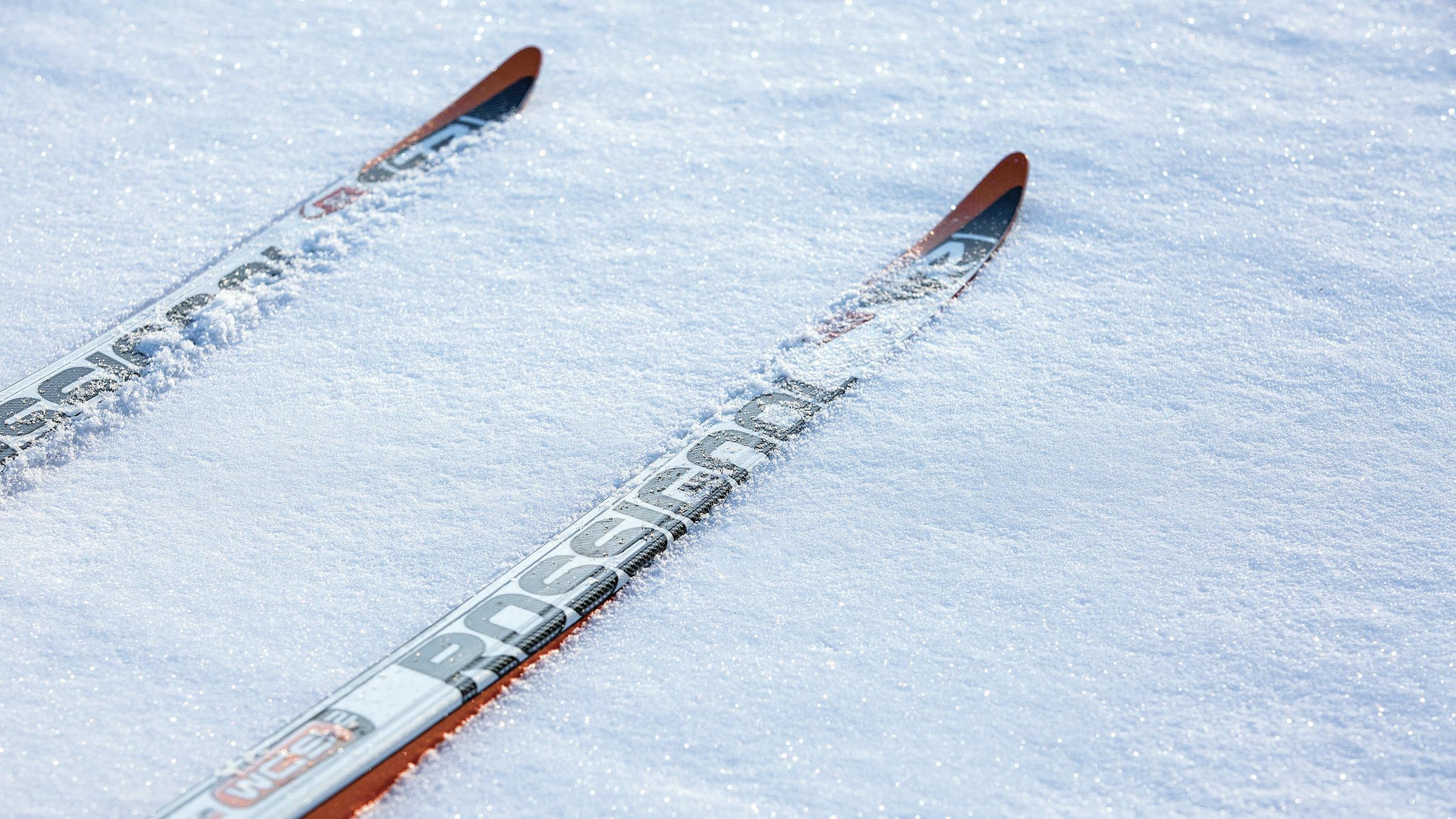 Close up of Rossignol cross-country skis on snow