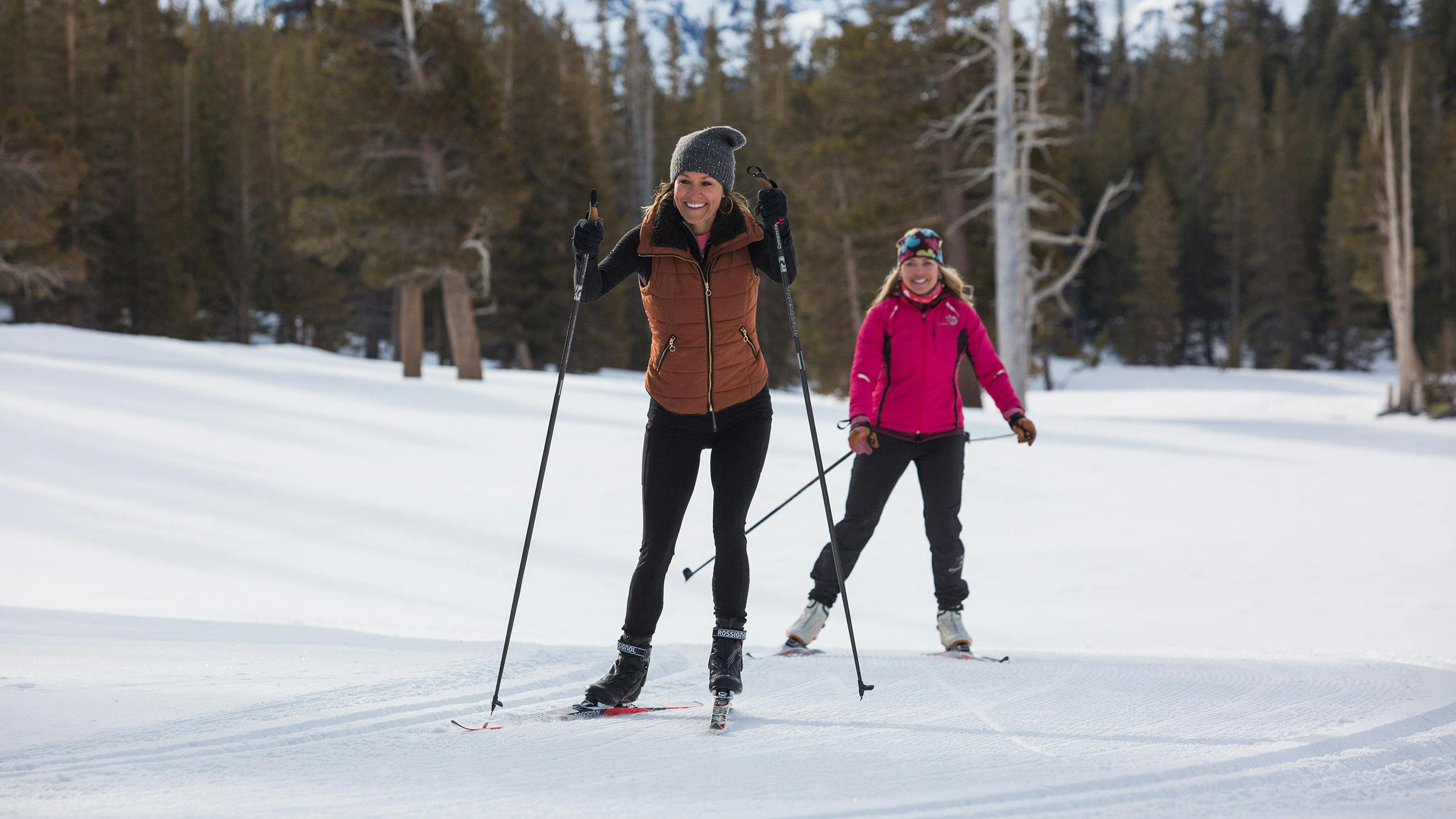 Two women cross-country skiing