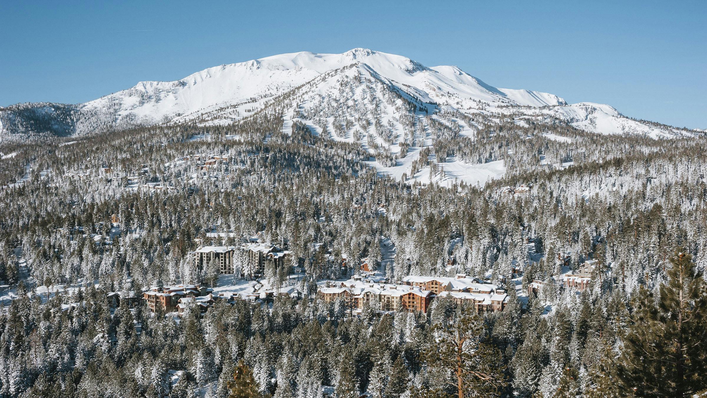 View of snow-covered Mammoth Mountain overlooking The Village at Mammoth