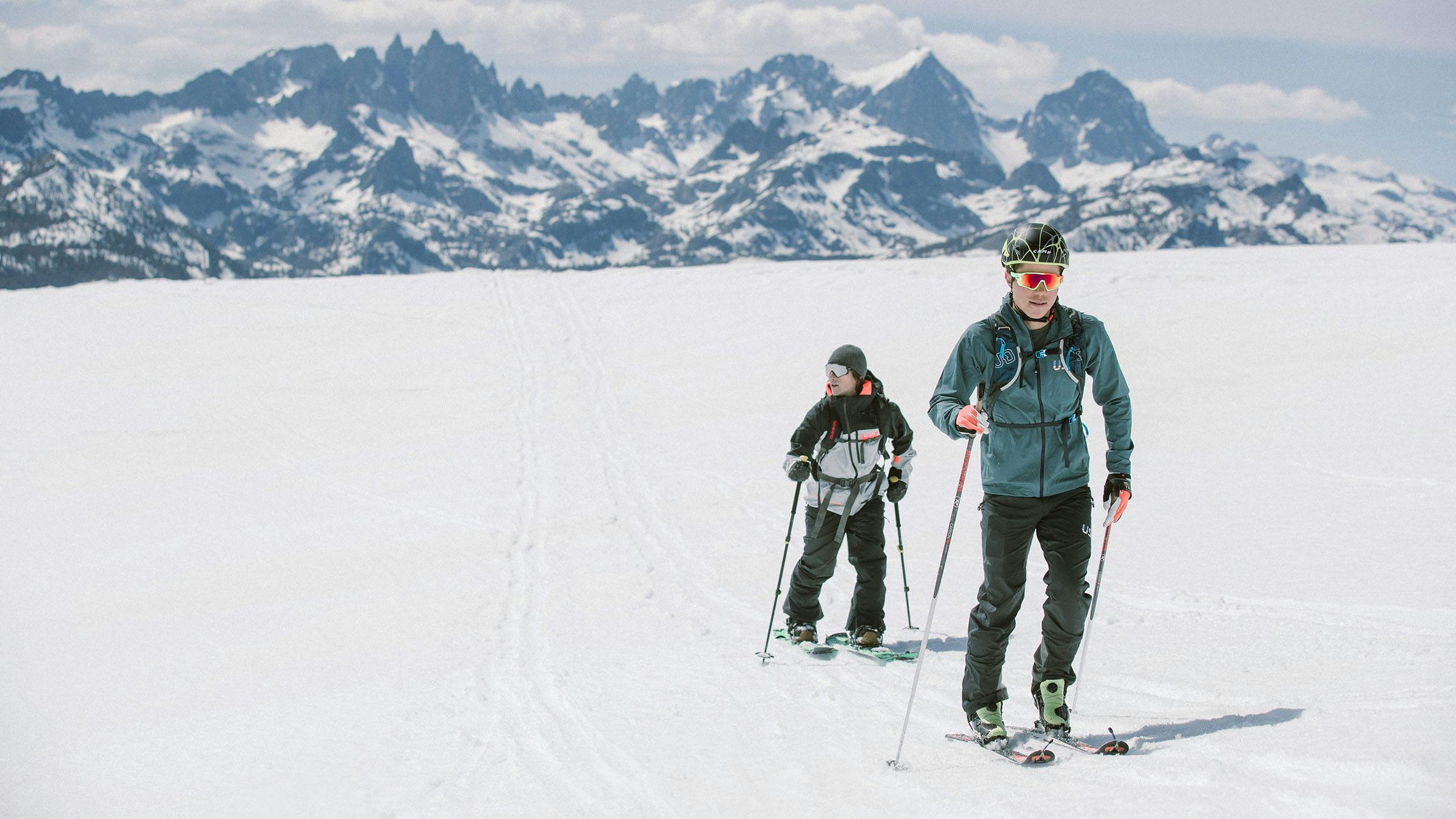 Backcountry skiers with the Minarets, Mount Ritter, and Banner Peak in the background